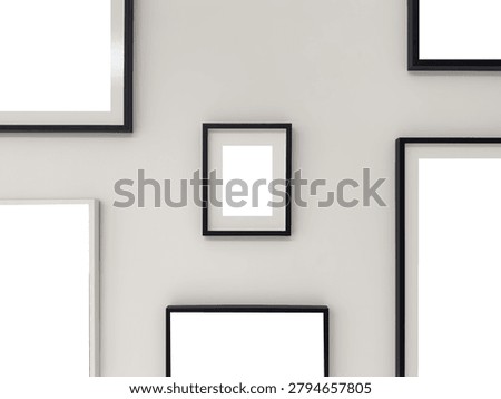 Empty black frames of various sizes arranged on a light gray wall. Minimalist gallery wall mockup template with one small centered frame with mat.