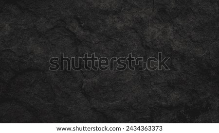 Empty black grain stone wall on cave for abstract  background and texture. beautiful patterns, space for work, banner,seamless wallpaper, close up.