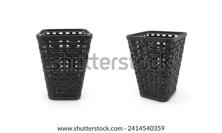 Empty black multipurpose plastic basket imitating rattan weaving, box for storing small items isolated on white background                               