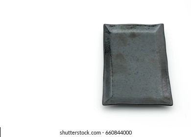 Empty black plate isolated on white background