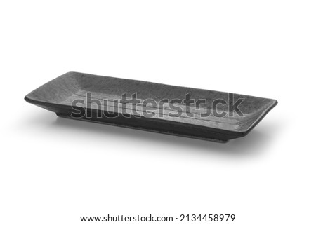 Empty black rectangular ceramic plate isolated on white background.