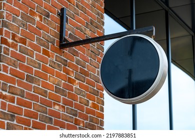 Empty Black Round Signboard On The Brick Wall