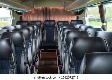 empty black seats on the bus. new black seats in the bus. The interior of a bus for tourists