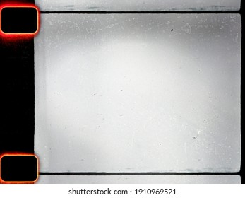 Empty Or Blank 16mm Film Frame With Black Border And Dust. Film Scan.