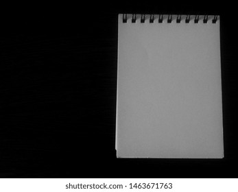 empty blank notepad sheets on dark and light background