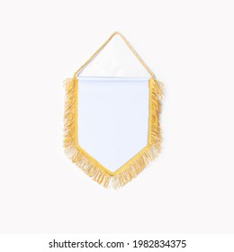 Empty blank Pennant white fabric with gold fringes on white background.