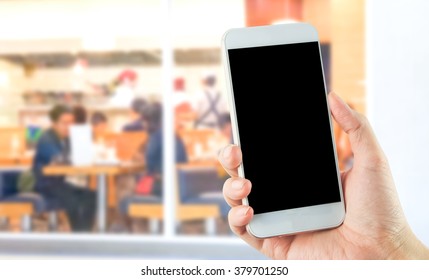 Empty Blank Smartphone In Hand With Busy Resturant Background