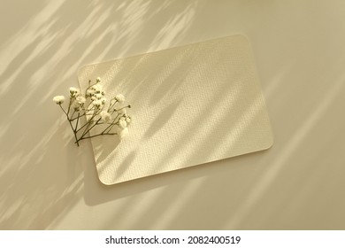 Empty Blank Texture Canvas Paper Card With Copy For Your Text Message And Flower. Light And Shadows Minimalism Style Template Background. Flat Lay, Top View. Beige Color Tone.