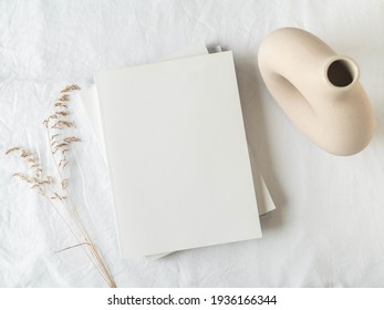 Empty Blank White Magazine Cover Mock Up, Vase And Dried Grass On Light Texture Background. Flat Lay. Top View. Copy Space