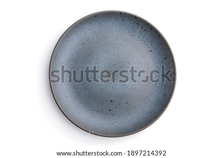 Empty blue ceramic plate isolated on white background. Top view, flat lay, close up.