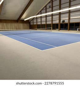 Empty blue indoor tennis court
 - Shutterstock ID 2278791555