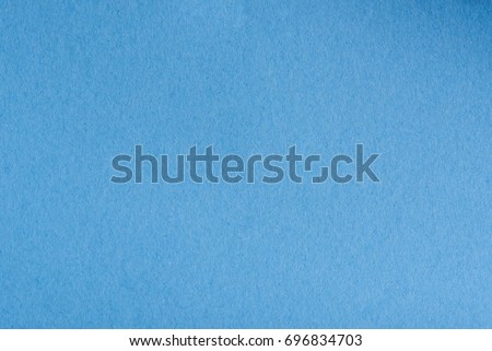 Empty blue paper page surface close-up. Blank blue colr paper texture