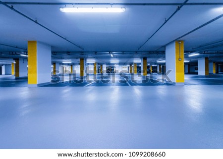 Similar – Empty multi-storey car park with yellow columns