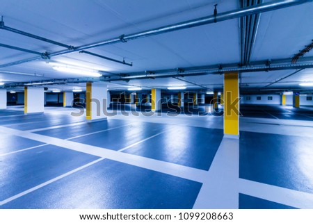 Similar – Empty multi-storey car park with yellow columns