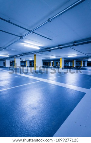 Empty multi-storey car park with yellow columns