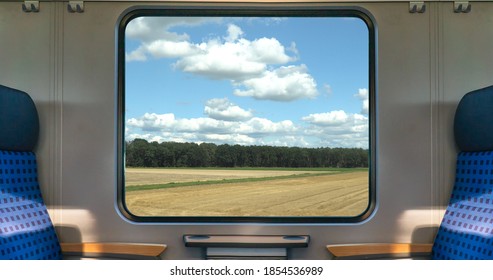 An Empty Blue Seat In Europe German Train With Window Corn Field Display Nature Summer View On The Railway Road Transportation During Coronavirus 