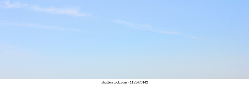 Empty Blue Sky Background and Simple Natural Texture Template of Pale Blue Sky with Small Clouds. Backdrop of Light Blue Color, Blur Sky Texture, Blank Sky Wallpaper Poster for Copy Space.