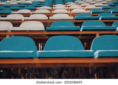 Empty blue white stadium seats, empty bleachers