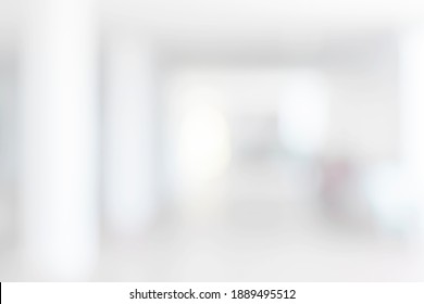 Empty blur white corridor hallway of modern white office building room with entrance door business blur background