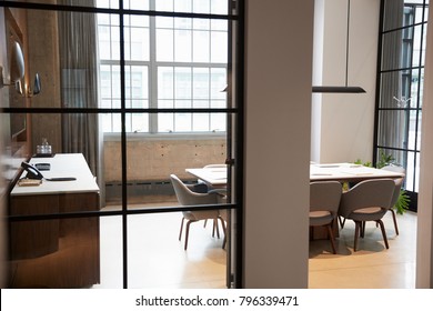 Empty Boardroom At A Business Seen Through Open Door