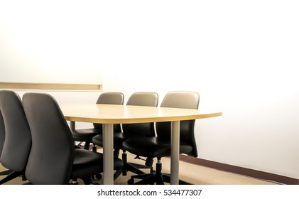 Empty Boardroom For Meeting In Flare Light Warm Tone And White Space For Fill Text.