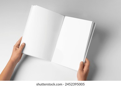 Empty Book Template on White Background, hands Open book with blank pages. Mock up for design - Powered by Shutterstock