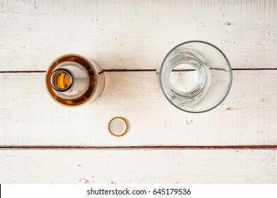 Empty Bottle Beer And Glass On Wooden Background. Top View