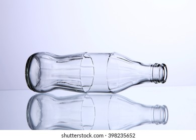 Empty bottle of cola isolated on a white background