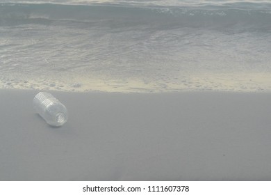Empty bottle on the beach