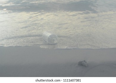 Empty bottle on the beach