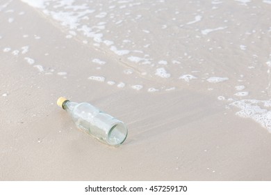 Empty bottle on the beach