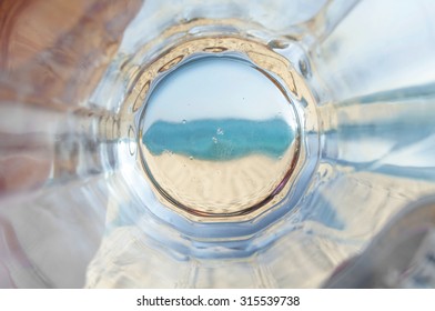 Empty Bottom Mug Of Drained Fresh Beer On The Beach