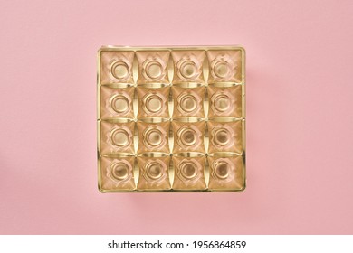 Empty Box Of Chocolates On Pink Pastel Background