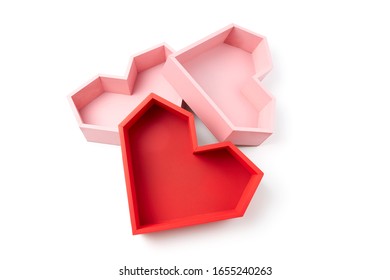 Empty boxes in the form of pink and red faceted hearts on a white background.