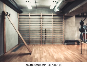 Empty Boxing Area In The Gym. Fitness Club With Equipment. Sports Background With Rough Concrete Walls