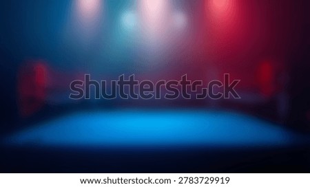 An empty boxing ring is illuminated by dramatic red and blue spotlights creating a smoky, atmospheric effect in a dark arena.