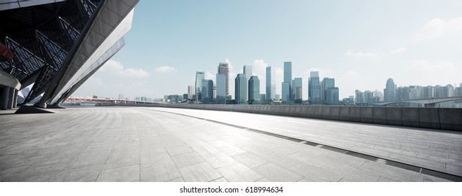 empty brick floor with cityscape of modern city - Shutterstock ID 618994634