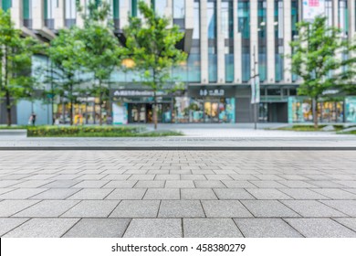 Empty brick floor with modern building in Shanghai