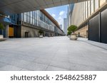 Empty brick floor and modern city buildings background