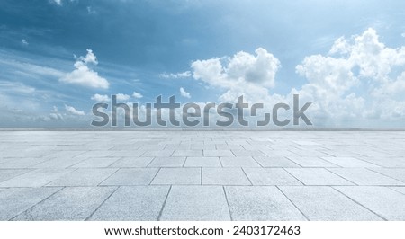 Empty brick floor and sky clouds background
