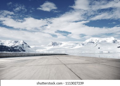 Empty Brick Ground With Sonw Mountain As Background