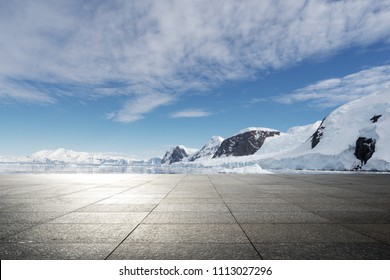 Empty Brick Ground With Sonw Mountain As Background