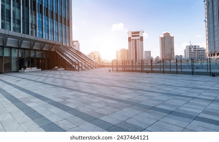 Empty brick road in front of office buildings