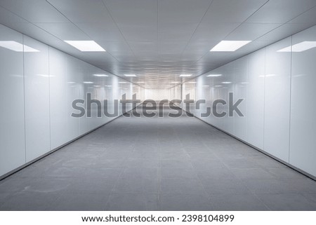 Empty and bright underground pedestrian passage in Shanghai, China