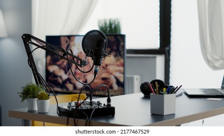 Empty Broadcasting Studio With Professional Audio Equipment And No Host. Radio Podcast Desk Inside Office Workspace With Laptop And Microphone And Nobody In It. Studio Shoot