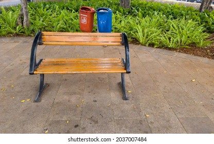 Empty Brown Bench In Small City Park In Jakarta