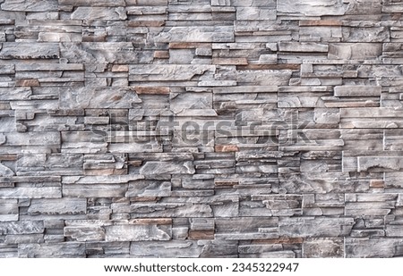 Empty brown and gray stone brick wall made with blocks for abstract  background and texture. beautiful patterns, space for work, banner, wallpaper close up, horizontal.