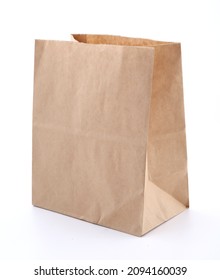Empty brown paper bag on white background