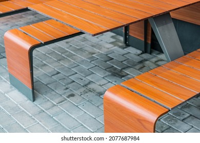 Empty Brown Solid Table With Benches Stands Outdoor On The Street. Outdoor Restaurant. Urban. No People. 2 In 1. Entire. Street