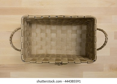 Empty Brown Wicker Handmade Crafts Basket On Wood Background View From Top Or Above / Eco Friendly Material From Nature